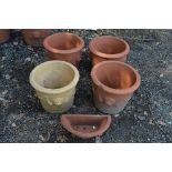 FOUR VARIOUS TERRACOTTA PLANT POTS, and a wall mounted plant pot (sd) (5)