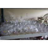 A QUANTITY OF GLASSWARE, mostly drinking glasses, to include Stuart and Edinburgh Crystal