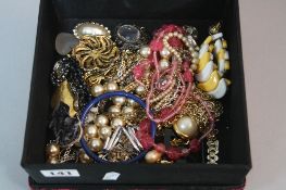 A BOX OF COSTUME JEWELLERY