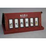 SIX BOXED CHINESE SILVER INGOTS, approximately 20 grams each, (certificates)