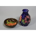 TWO PIECES OF MOORCROFT POTTERY, to include small 'Anemone' vase on blue ground, impressed and