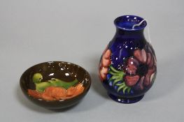 TWO PIECES OF MOORCROFT POTTERY, to include small 'Anemone' vase on blue ground, impressed and