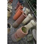 FIVE VARIOUS TERRACOTTA CHIMNEY POTS, and a painted chimney pot (sd) (6)