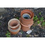 A QUANTITY OF TERRACOTTA PLANT POTS