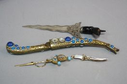 FOUR NOVELTY ITEMS, including two letter openers and two tie pins
