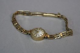 A MID - LATE 20TH CENTURY 9CT GOLD LADIES ROTARY WRIST WATCH, silver dial with gilt baton markers