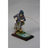 A DENNIS FAIRWEATHER FIGURE, Fisherman landing Trout