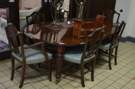 A VICTORIAN OVAL MAHOGANY PULL OUT DINING TABLE, and two extra leaves with clips, approximate