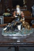 AN ART DEO STYLE FIGURE, of a seated lady with greyhound on a marble base