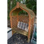 A PAINTED TEAK GARDEN ARBOUR/BENCH, approximate size height 208cm x width 135cm x depth 80cm