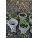 FOUR VARIOUS PRE-CAST GARDEN URNS