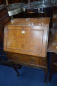 A WALNUT LADIES WRITING BUREAU, on cabriole legs