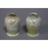 TWO COBRIDGE STONEWARE VASES, decorated with foliage and swallows, impressed marks to base,