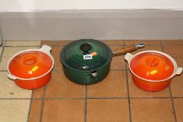 LE CREUSET, to include green covered saucepan and two orange covered casserol dishes (3)
