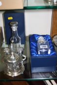 TWO BOXED ITALIAN ROYAL CRYSTAL ROCK GLASS CONDIMENT BOTTLES, the stoppers with silver mounts,