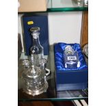 TWO BOXED ITALIAN ROYAL CRYSTAL ROCK GLASS CONDIMENT BOTTLES, the stoppers with silver mounts,