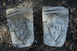 TWO PRE CAST WALL MOUNTS DEPICTING MALE FACES