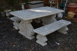 A CONCRETE STYLE GARDEN BENCH, on a pair of supports, approximate size width 191cm x depth 93cm x