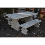 A CONCRETE STYLE GARDEN BENCH, on a pair of supports, approximate size width 191cm x depth 93cm x