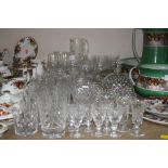 A QUANTITY OF GLASSWARE INCLUDING LIQUEUR DECANTER AND GLASSES WITH WHITE SPOTS, includes Webb