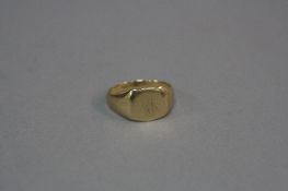 A MID - LATE 20TH CENTURY SIGNET RING, shield shape head, ring size S1/2, stamped '9ct', approximate