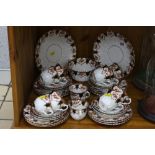 A ROYAL ALBERT CROWN CHINA TEA SET, approximately thirty six pieces