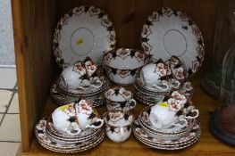 A ROYAL ALBERT CROWN CHINA TEA SET, approximately thirty six pieces