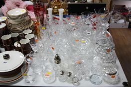 A QUANTITY OF GLASSWARE, including decanters, coloured glass vases, etc