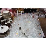 A QUANTITY OF GLASSWARE, including decanters, coloured glass vases, etc