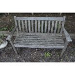 A TEAK GARDEN BENCH, approximate length 127cm