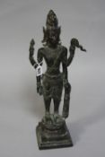 A BRONZED EASTERN FIGURE, standing with four arms, height approximately 48cm