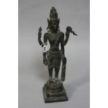 A BRONZED EASTERN FIGURE, standing with four arms, height approximately 48cm