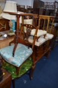 A WALNUT COFFEE TABLE, two dining chairs, nursing chair and two occasional tables and a footstool (