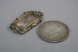 A CHINESE SILVER DOLLAR, and a Suisse half ounce silver fob (2)