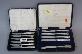 A CASED SET OF SIX SILVER HANDLE TEA KNIVES, makers B. Brs, Sheffield 1938, together with an