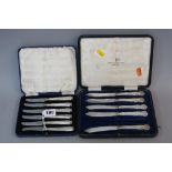 A CASED SET OF SIX SILVER HANDLE TEA KNIVES, makers B. Brs, Sheffield 1938, together with an