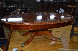 A MODERN MAHOGANY OVAL TOPPED COFFEE TABLE