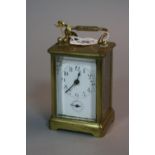 A BRASS CARRIAGE CLOCK, approximate height 9.5cm