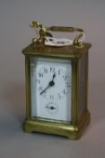 A BRASS CARRIAGE CLOCK, approximate height 9.5cm