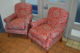 A PAIR OF FLORAL UPHOLSTERED ARMCHAIRS