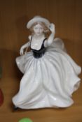 A COALPORT FIGURINE, not named and marked to base with 'X'