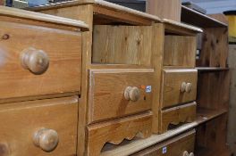 A PAIR OF PINE BEDSIDE UNITS (sd)