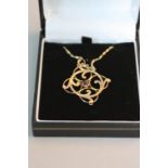 AN EDWARDIAN 9CT PENDANT AND CHAIN