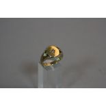 A 9CT SIGNET RING SET WITH A DIAMOND, ring size W, approximate weight 7.4 grams