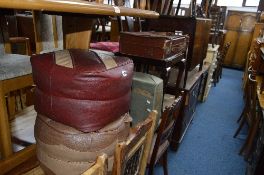 TWO LEATHER STYLE STUFFED FOOTSTOOLS, two various cases and a vintage cardboard case (5)