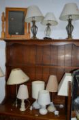 A PINE DRESSING TABLE MIRROR, two standard lamps, nine table lamps and a warming pan (13)