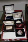 TWO 100 GRAMMES SILVER INGOTS, one ounce troy ingot, a 1991 Rugby World Cup silver coin and 1981