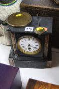 A SLATE MANTEL CLOCK, glass missing and back loose, pendulum only