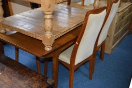 A MCINTOSH TEAK EXTENDING DINING TABLE, and six chairs including two carvers (7)