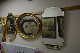 TWO OVAL GILT FRAMED BEVELLED EDGE WALL MIRRORS, and another mirror (3)